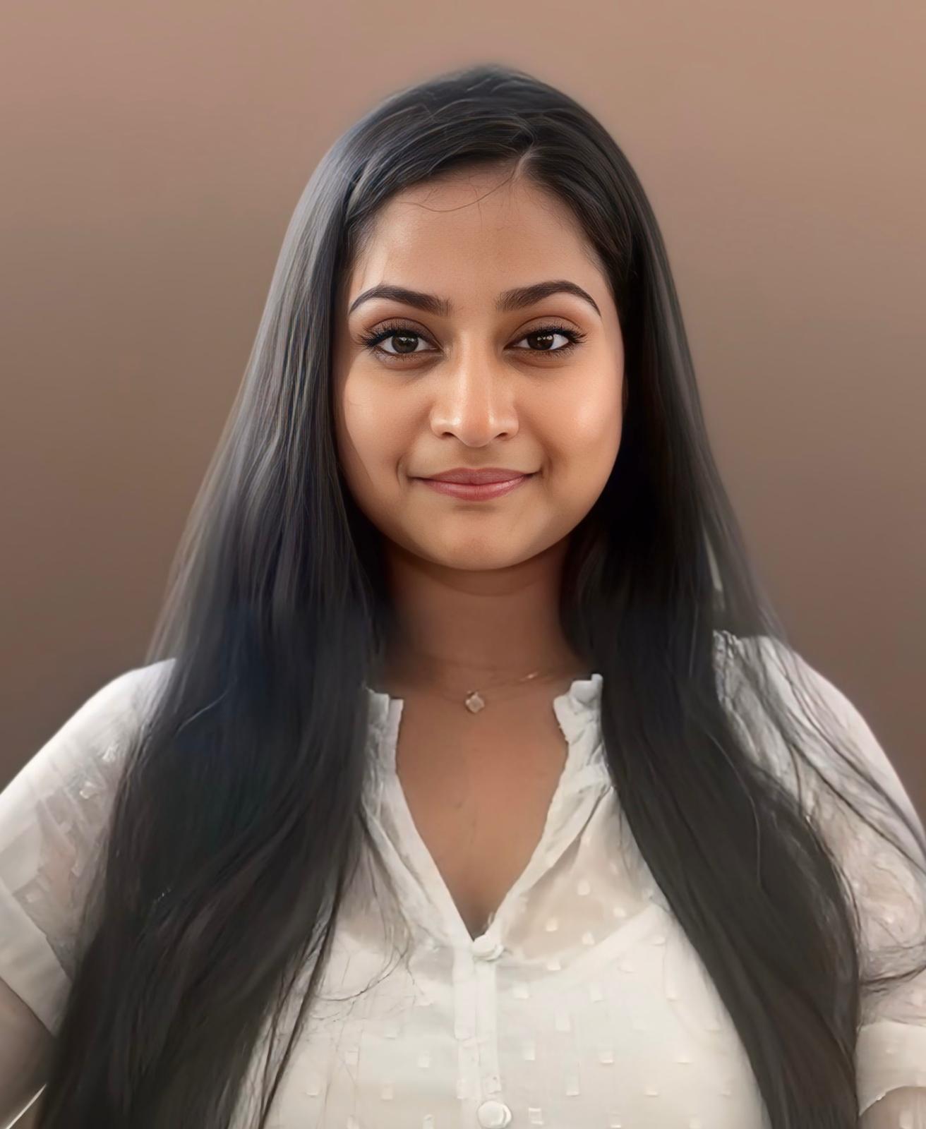 Professional headshot of the therapist